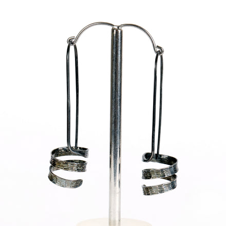 Swarf round earrings - chased and polished finish