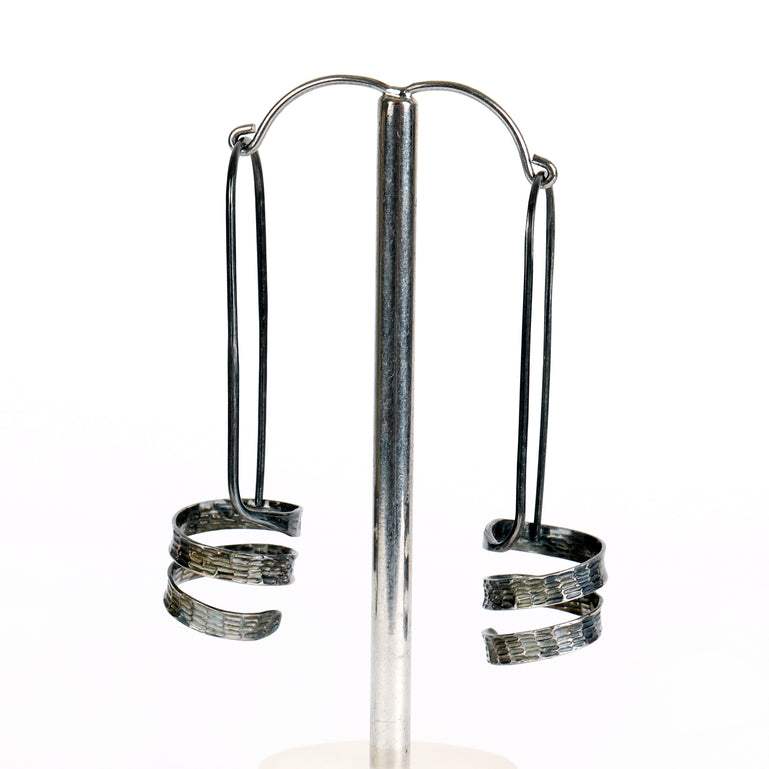 Swarf round earrings - chased and polished finish